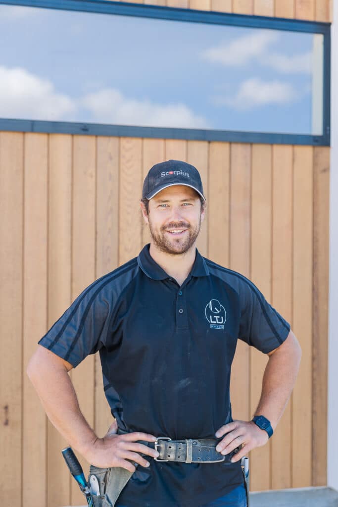 Photo of builder wearing toolbelt